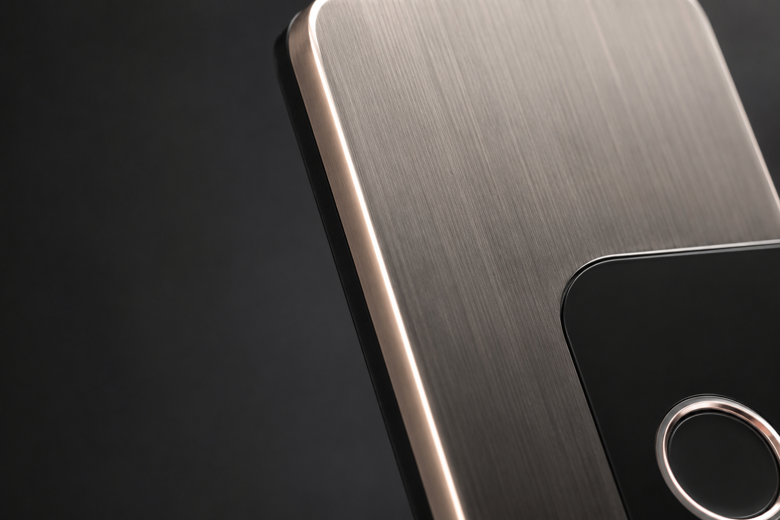 Close-up of brushed stainless steel on a smart lock panel